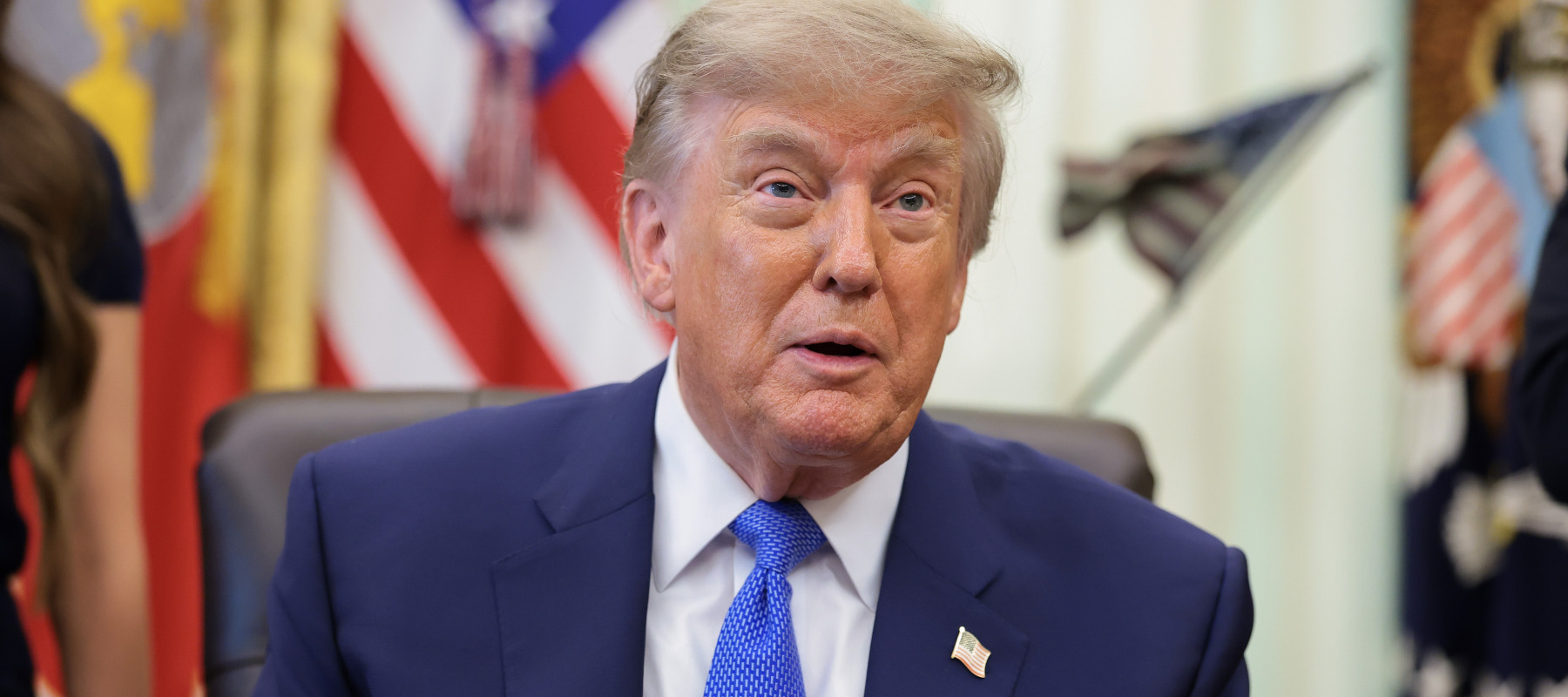 U.S. President Donald Trump speaks to reporters after signing an executive order requiring parents to make more doctor visits spaced out to receive childhood vaccines.