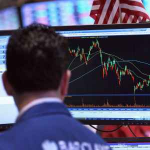 A trader looks at a stock run-up during a bull market.