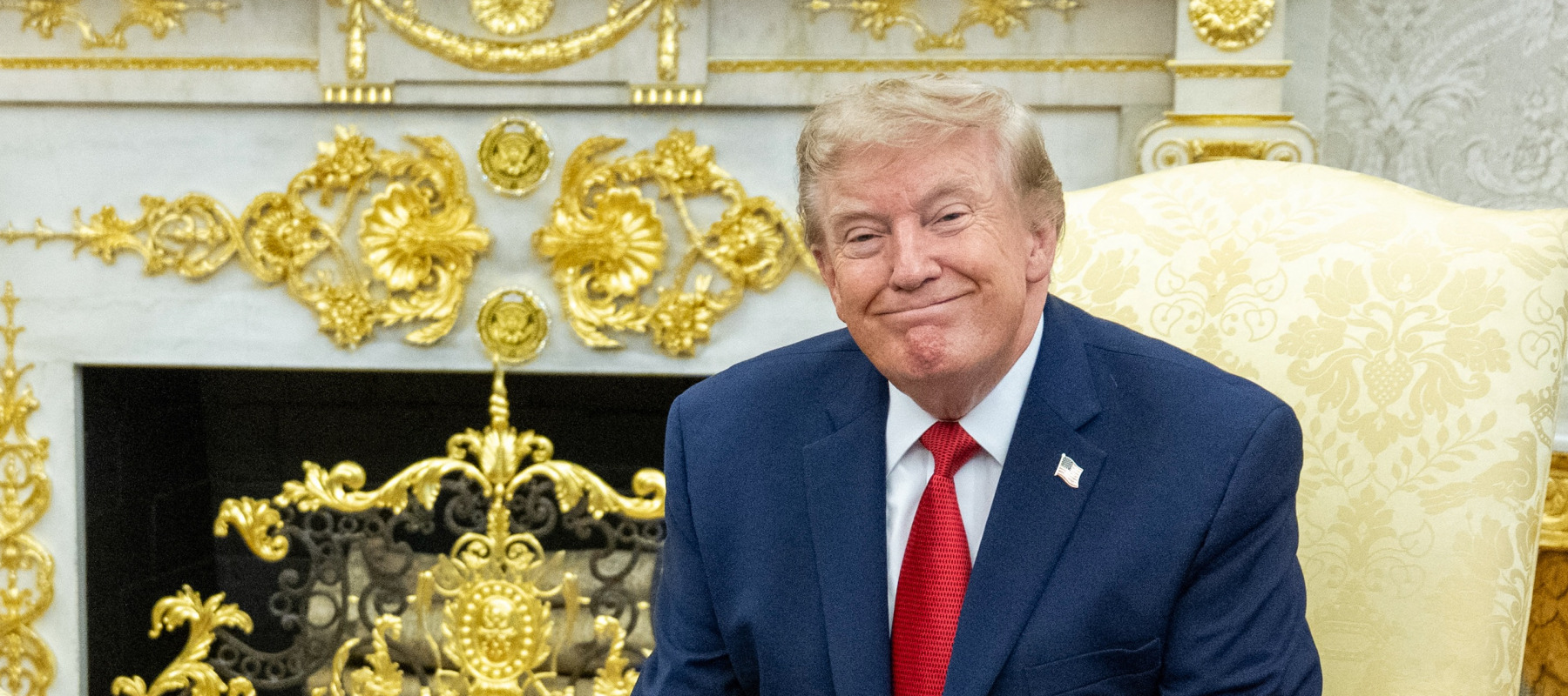 US President Donald Trump meets with lifeguard Ryder Williams (L) in the Oval Office of the White House in Washington, DC.