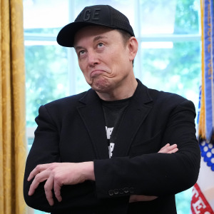 Elon Musk speaks alongside President Trump to reporters in the Oval Office.