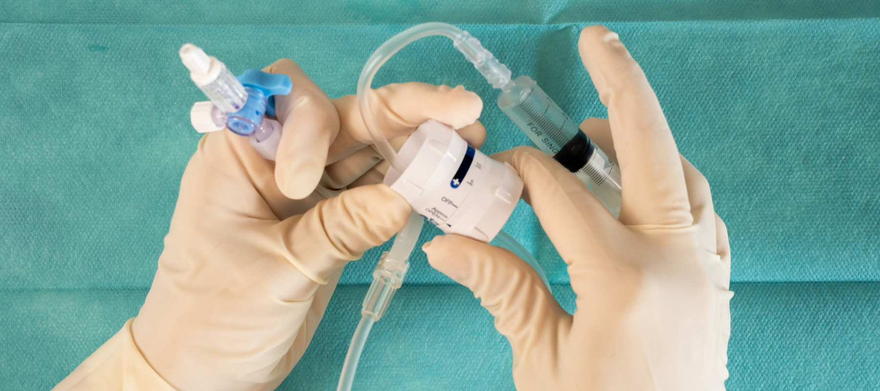 A nurse administering an epidural.
