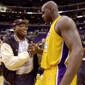 Shaquille O'Neal of the Los Angeles Lakers is congratulated by his father, Philip Harrison.