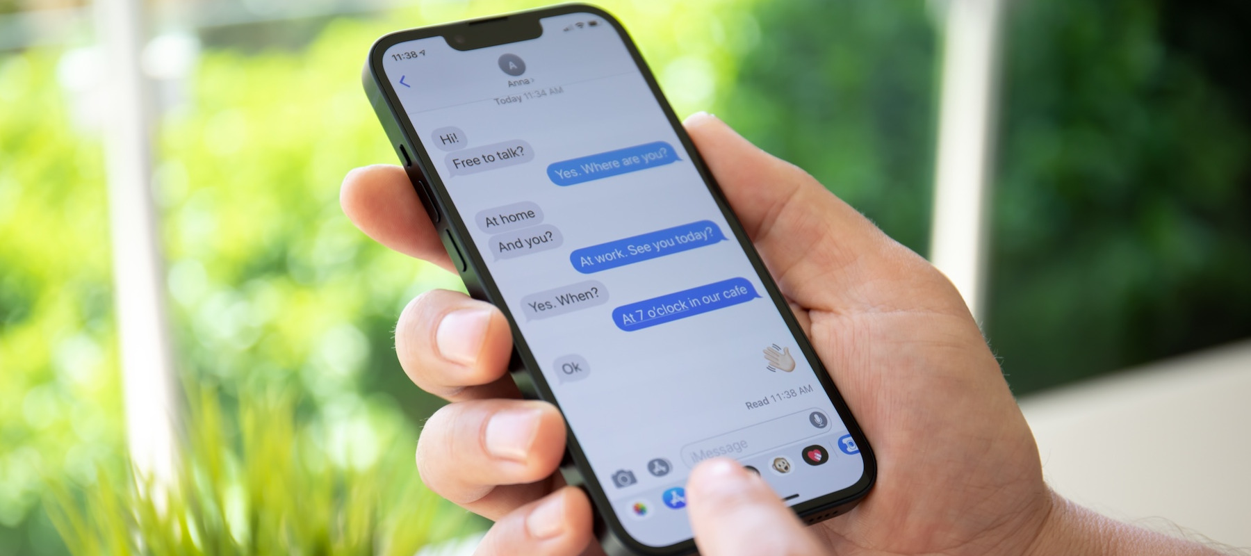 A person using iMessage to text.