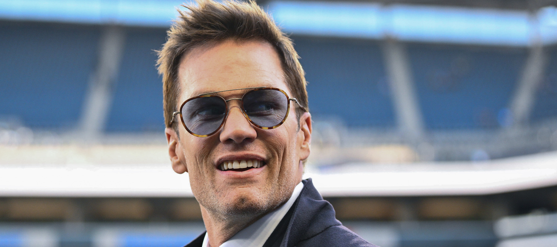 Former NFL player Tom Brady looks on prior to a game between the Los Angeles Rams and the Seattle Seahawk.