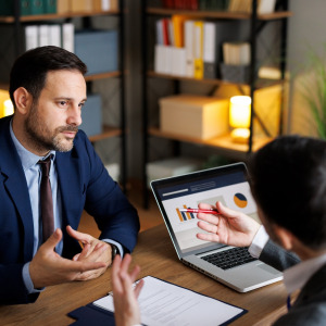 Financial advisor talking to his client.