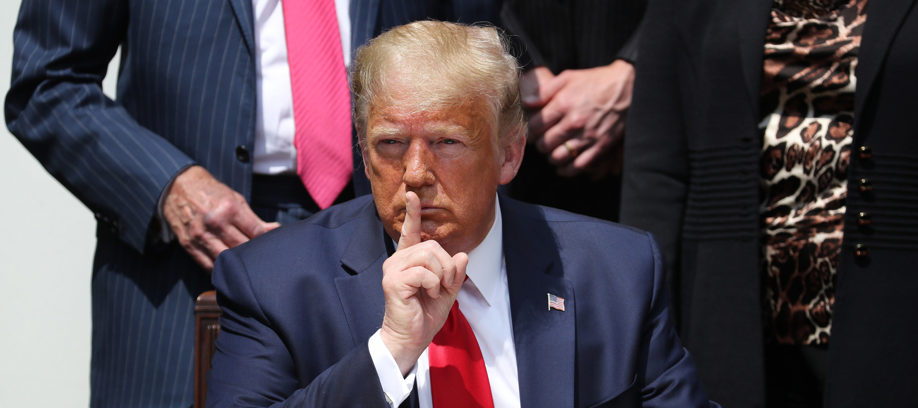 U.S. President Donald Trump shushes journalists before signing the Paycheck Protection Program Flexibility Act in the Rose Garden at the White House.