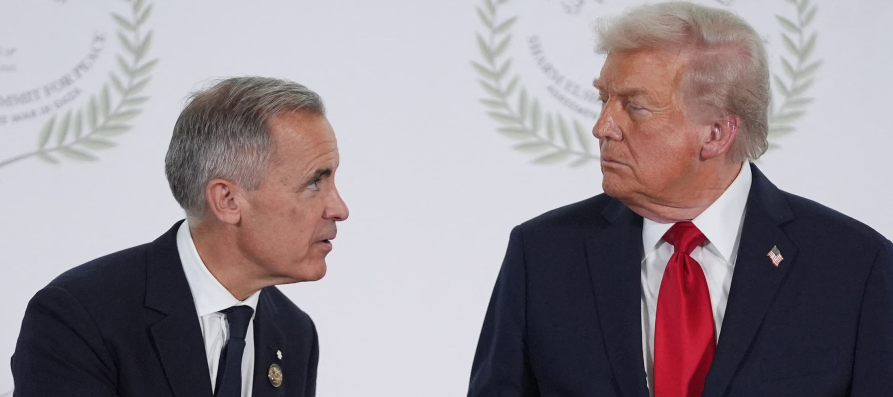 A photo of Mark Carney and Donald Trump