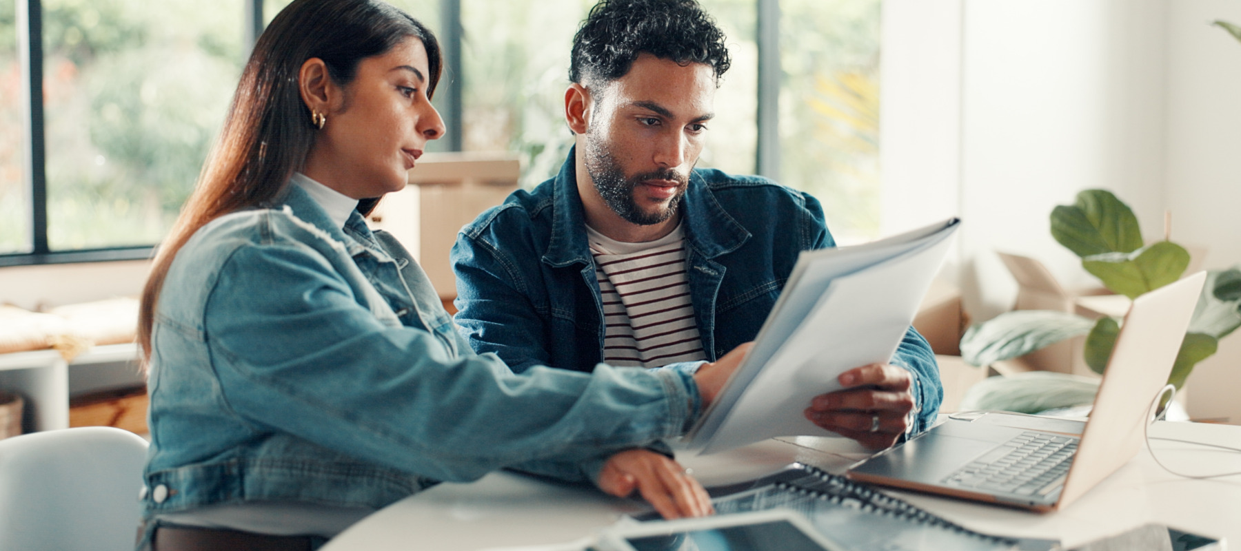 A young couple going over their finances together.