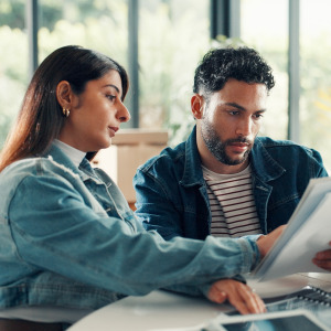 A young couple going over their finances together.