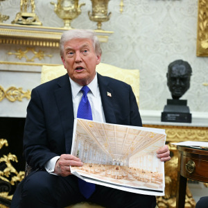 US President Donald Trump shows an image of his planned ballroom as he meets with NATO Secretary General Mark Rutte in the Oval Office of the White House