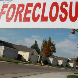 A sign is seen in front of a foreclosed home.