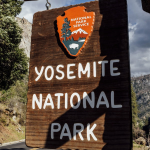 Overlay of the entrance to Yosemite National Park and President Donald Trump
