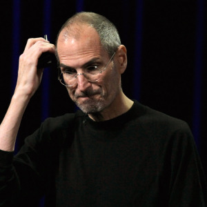 Photo of Steve Jobs looking down on stage, with bubble overlay showing homemade science fair project.