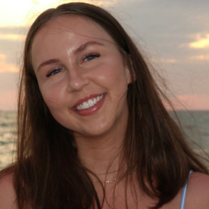 Photo of Erin Spencer in front of a sunset