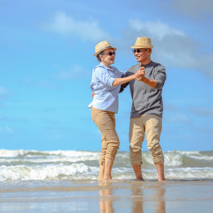 A older couple enjoying their time at the beach.