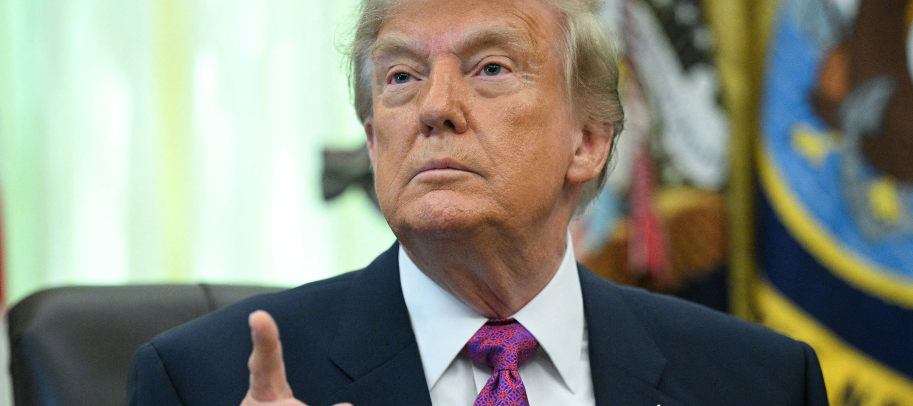 US President Donald Trump speaks after signing an executive order that aims to rename Lake Ontario to Lake America.