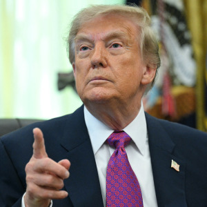 US President Donald Trump speaks after signing an executive order that aims to rename Lake Ontario to Lake America.
