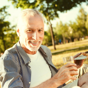 Photo of an older couple enjoying a picnic