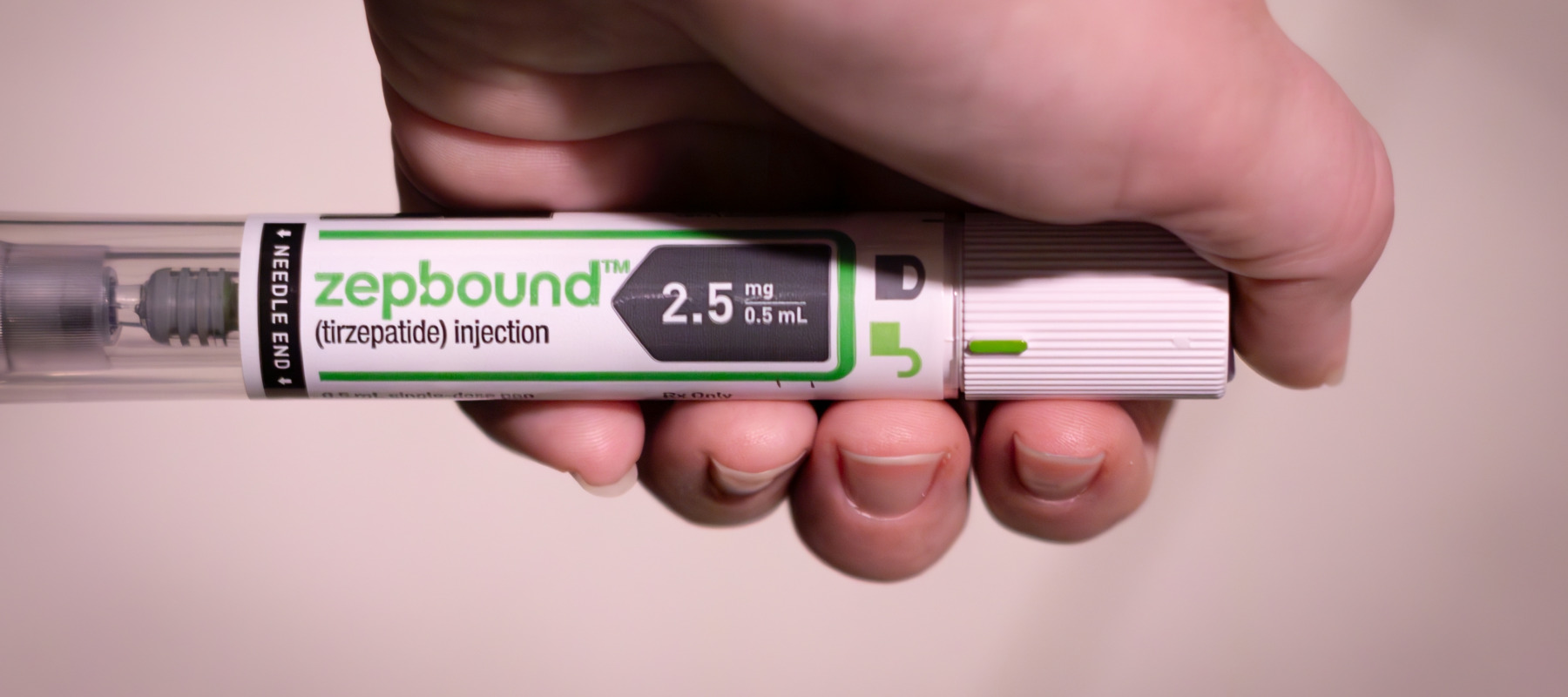 Hand of a patient using the injectable GLP-1 medication Zepbound.
