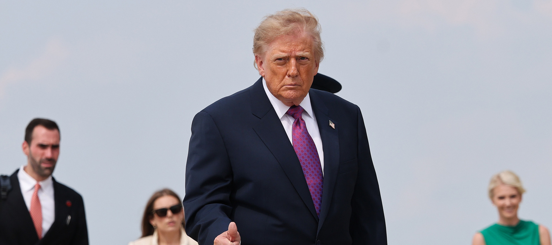 U.S. President Donald Trump gives a thumbs up as he arrives to board Air Force One.