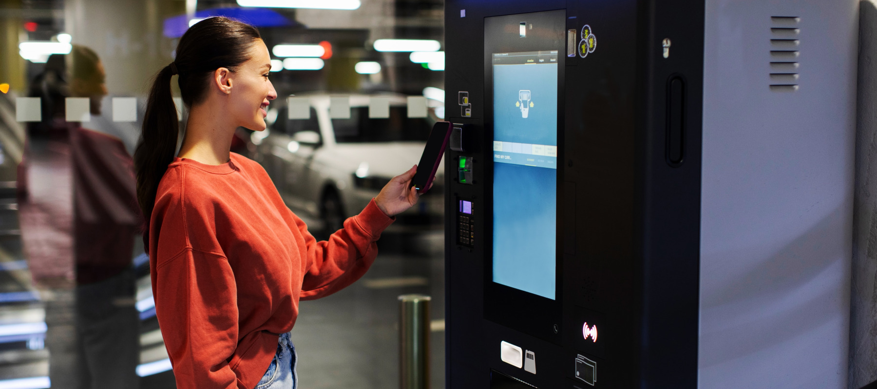 Woman pays for mall parking with her smartphone