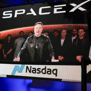 SpaceX CEO Elon Musk, displayed on a screen remotely from SpaceX headquarters in Starbase, Texas, speaks before the launch of SpaceX's initial public offering (IPO).