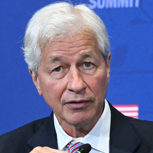 Jamie Dimon, CEO of JP Morgan Chase, speaks alongside US President Donald Trump.