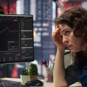 Stressed investor watching the stocks market.