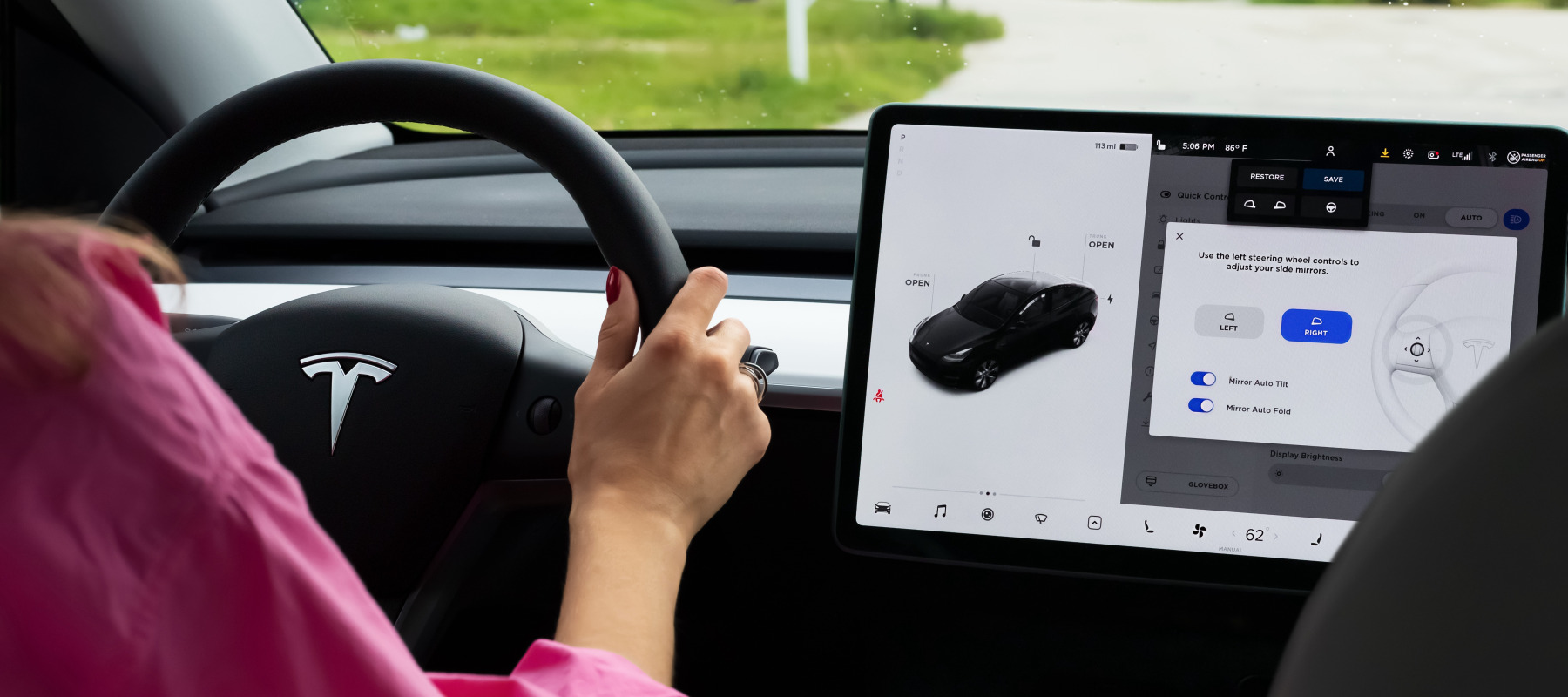 Woman driving a Tesla