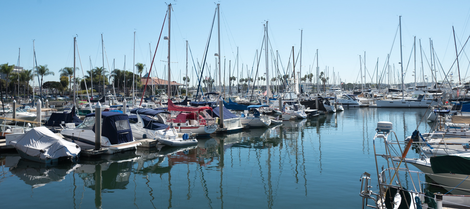 Marina Del Rey Sailboats and motorboats moored in a harbor on a sunny day in the Marina del Rey neighborhood of Los Angeles, California.