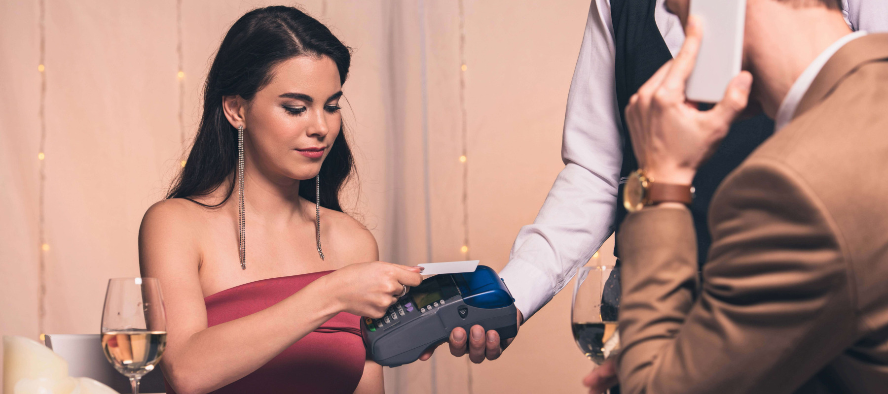 Woman paying for her own dinner on a date.