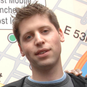 Sam Altman surrounded by Craig Thole of Boost Mobile (left) and the rapper Fabolous