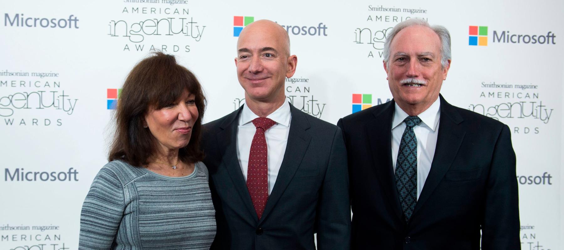 Amazon founder Jeff Bezos surrounded by his parents: Jackie (left) and Mike (right)