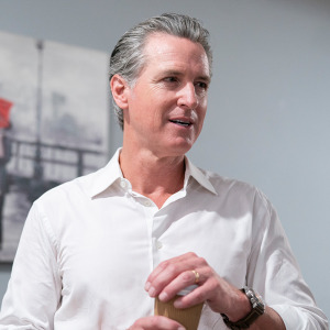 A two-column photo collage featuring California Governor Gavin Newsom and a cluster of grapes growing in the Napa Valley.