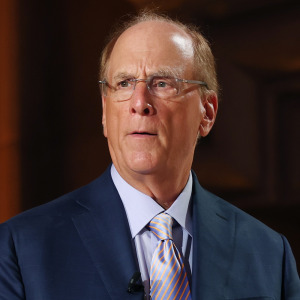 Blackrock founder Larry Fink looks serious walking out on stage