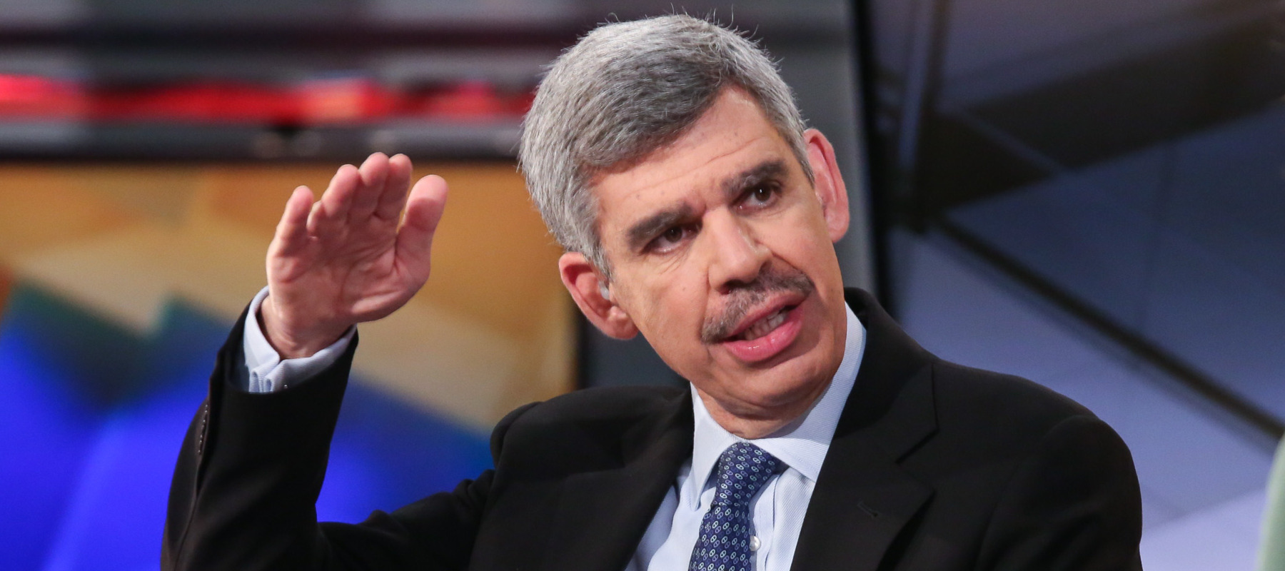 Mohamed El-Erian raises his hand while talking with Fox News' Maria Bartiromo