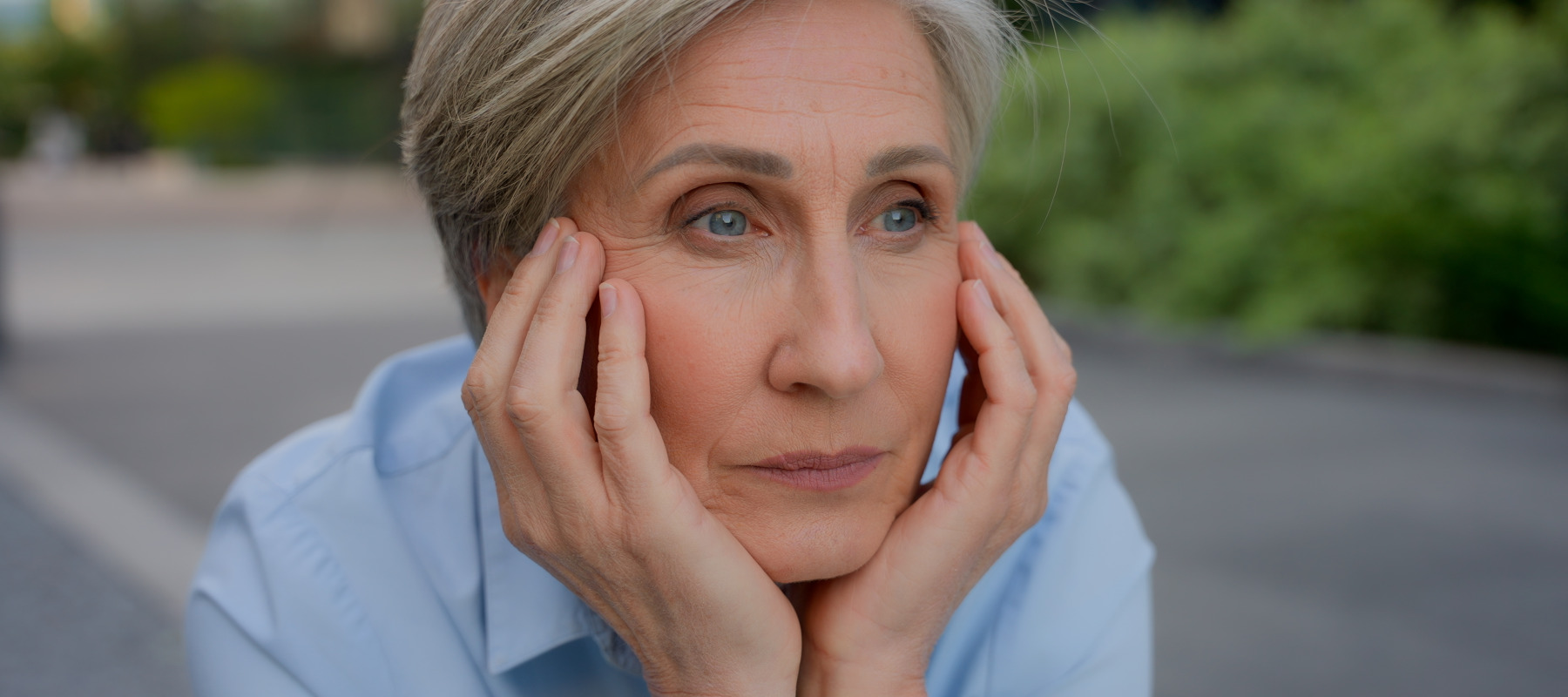 Woman stares off into the distance, stressing about the future of Social Security.