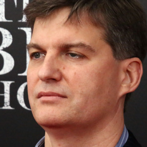 A nervous dog next to an image of Michael Burry at the premiere of The Big Short.