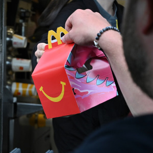 Person getting Happy Meal in McDonald’s drive thru