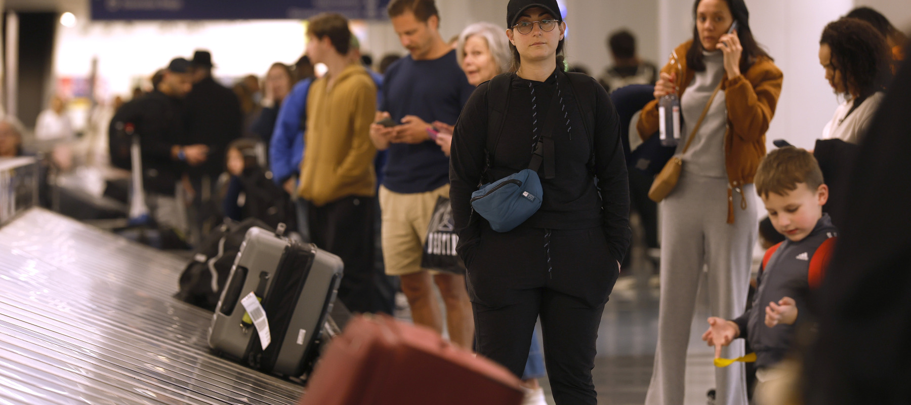 Travelers wait for their luggage at Los Angeles International Airport.
