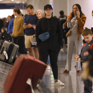 Travelers wait for their luggage at Los Angeles International Airport.