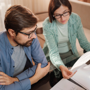 Brother and sister discussing father’s will and estate