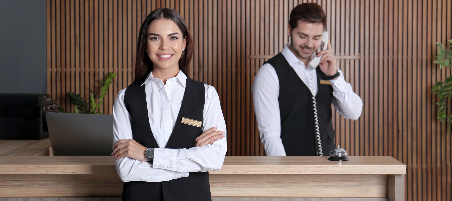 Hotel staff at reception desk