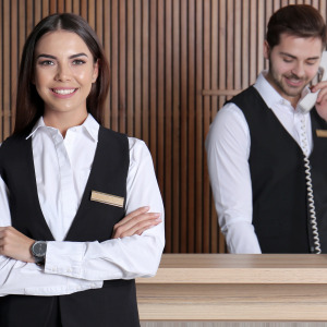Hotel staff at reception desk