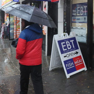 An EBT sign is displayed on the window of a grocery store in the Flatbush neighborhood of the Brooklyn, New York City.