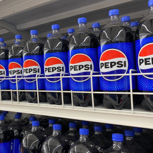 Bottles of Pepsi in a grocery store.