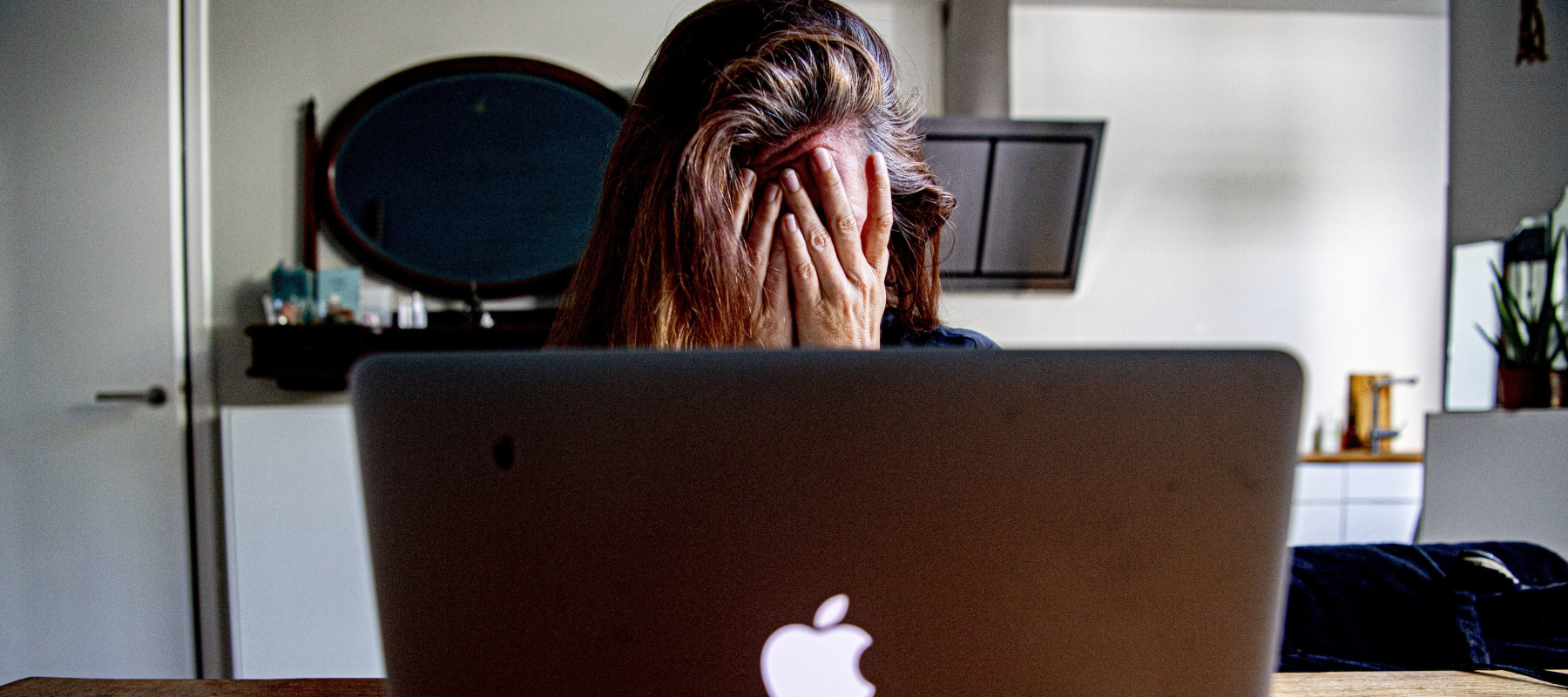 woman covering face