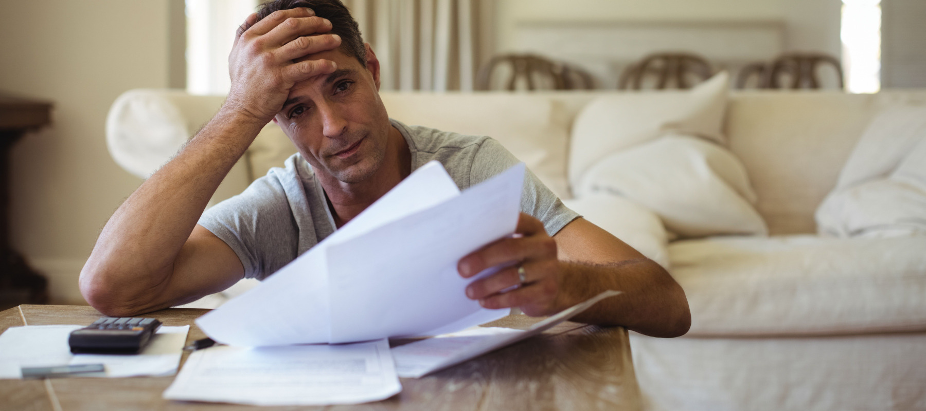 Man stressed out by his medical bills