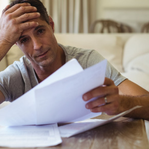 Man stressed out by his medical bills