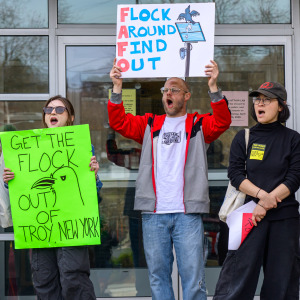 On the left, a Flock Security system mounted to a tree and on the right, a group protesting against the company.